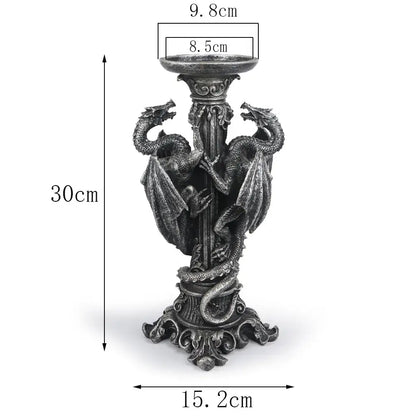 Vintage silver dragon candlestick sculptures featuring two dark metallic dragons coiled on a 30cm ornate candlestick