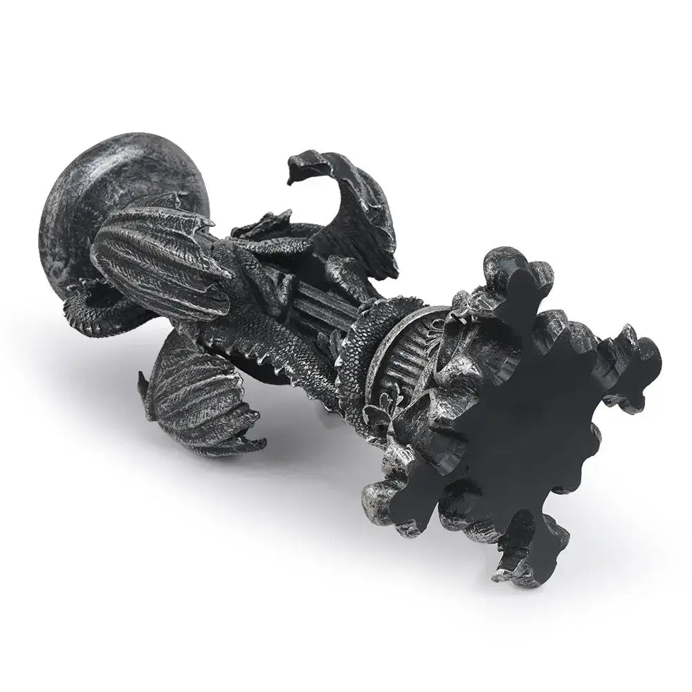 A dark vintage silver dragon candlestick sculpture with intricate metallic scales and ornate wings for dining room decor