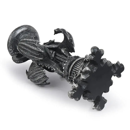 A dark vintage silver dragon candlestick sculpture with intricate metallic scales and ornate wings for dining room decor