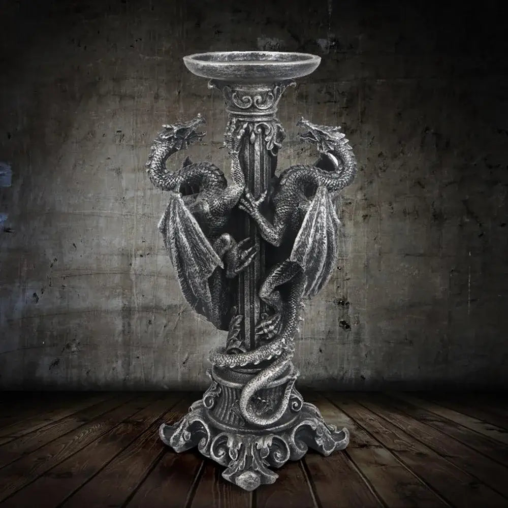 Vintage silver dragon candlestick sculptures featuring intricately sculpted dragons coiled around a silver-toned candlestick