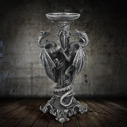 Vintage silver dragon candlestick sculptures featuring intricately sculpted dragons coiled around a silver-toned candlestick