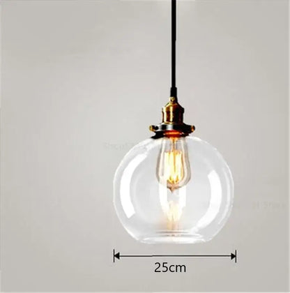 Vintage smoked glass ball pendant lights set of 4 with clear glass globe, brass fixture, and exposed filament bulb by decorbites glass ball