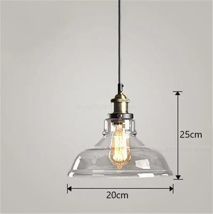 Clear glass dome pendant light with brass-finished socket and exposed filament bulb from vintage smoked glass ball pendant lights set by decorbites glass ball