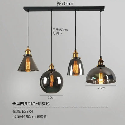 Industrial-style pendant lights set of 4 with smoked glass ball shades and brass accents on black ceiling mount decorbites glass ball