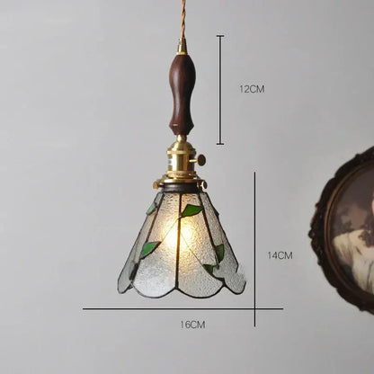 Vintage stained glass copper pendant light with knob switch dark wood handle brass hardware and green leaf motifs