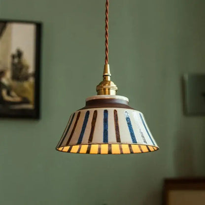 Vintage striped ceramic coloured glaze pendant light with flared cream blue brown shade and twisted copper cord for dining room
