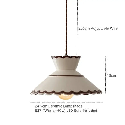 Cream-colored ceramic coloured glaze pendant light with scalloped edge dark brown trim and 200cm twisted wire suspension