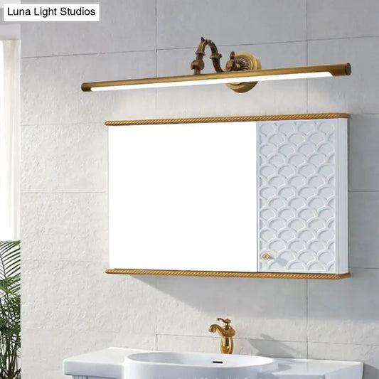 Vintage style gold metallic tubular wall light with a sleek elongated bar design and ornate decorative fixtures for bathroom vanity