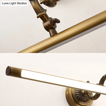 Antique brass-finished vintage style wall light with sleek rectangular bar and ornate hardware for bathroom vanity led use