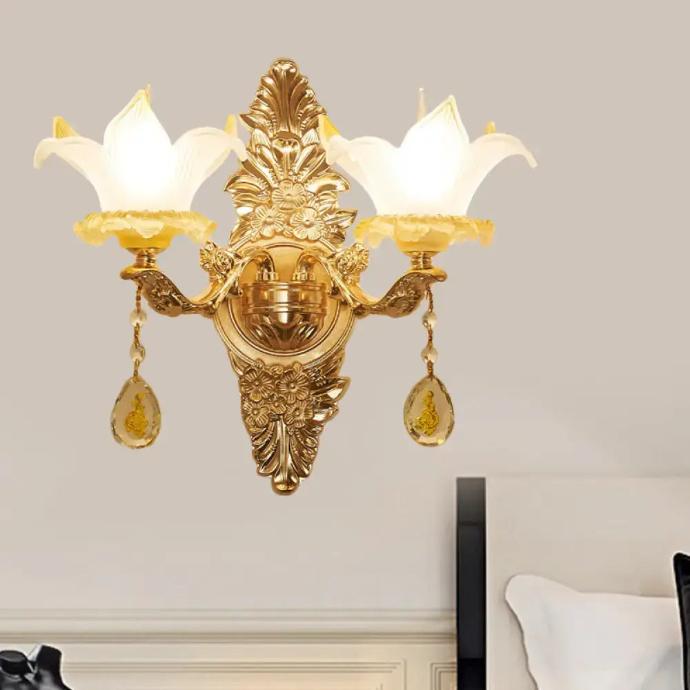 Vintage style gold wall light with opal glass lily shades and teardrop crystal pendants for bedroom decor