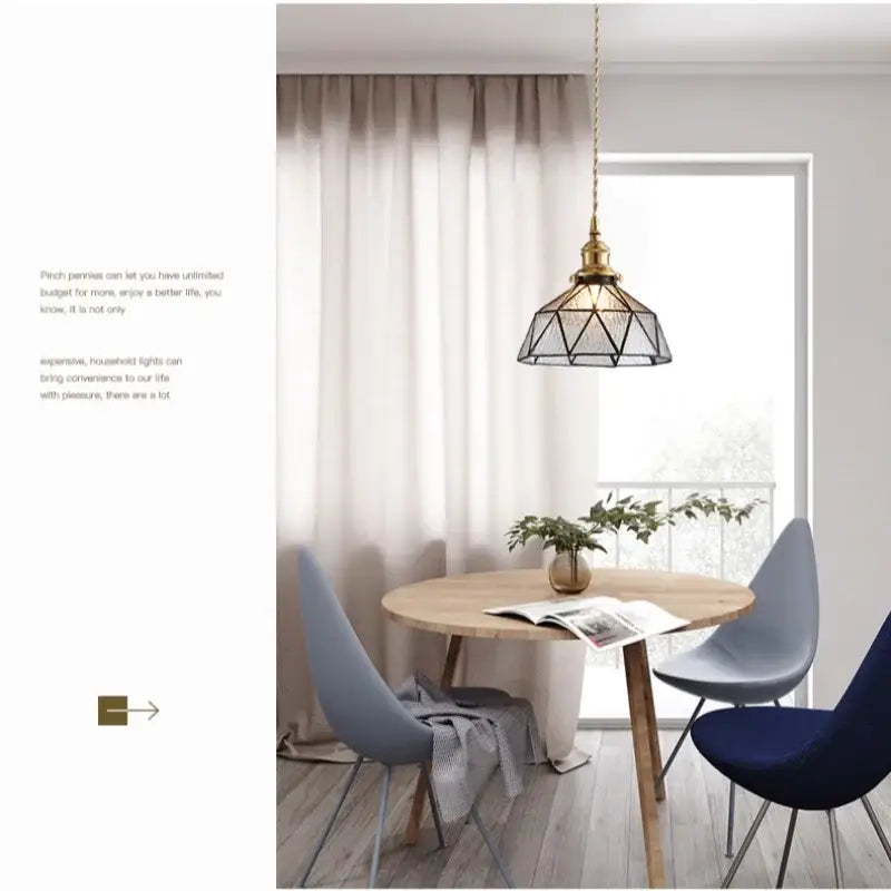 A brass-finished pendant light with a geometric cage and teal blue glass led shade for kitchen decorbites blue glass