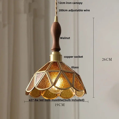 Vintage teal blue glass led pendant light with warm amber stained glass, walnut handle, and brass accents for decorbites blue glass decor