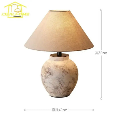 A rustic beige vintage white and gray decorbites ceramic led table lamp with textured ceramic led table finish and tapered shade