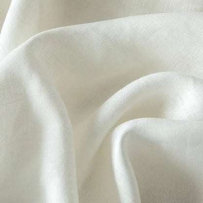 Vintage white and gray linen bedding set featuring soft off-white linen fabric with subtle textured weave and gentle folds