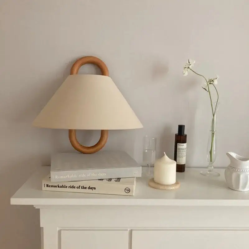 Beige wabi-sabi beech wood wall lamp with fabric conical shade and wooden ring handle for bedroom lighting