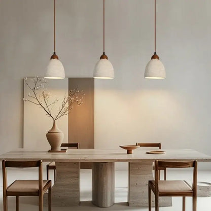Three wabi sabi beige cement pendant lights with textured ceramic shades and wooden fixtures for dining room decorbites cement pendant
