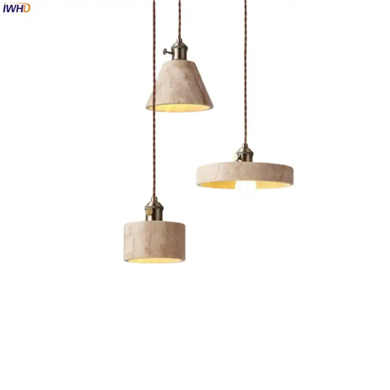 Three beige textured concrete pendant lights with brass hardware for dining room decorbites led yellow travertine ambiance