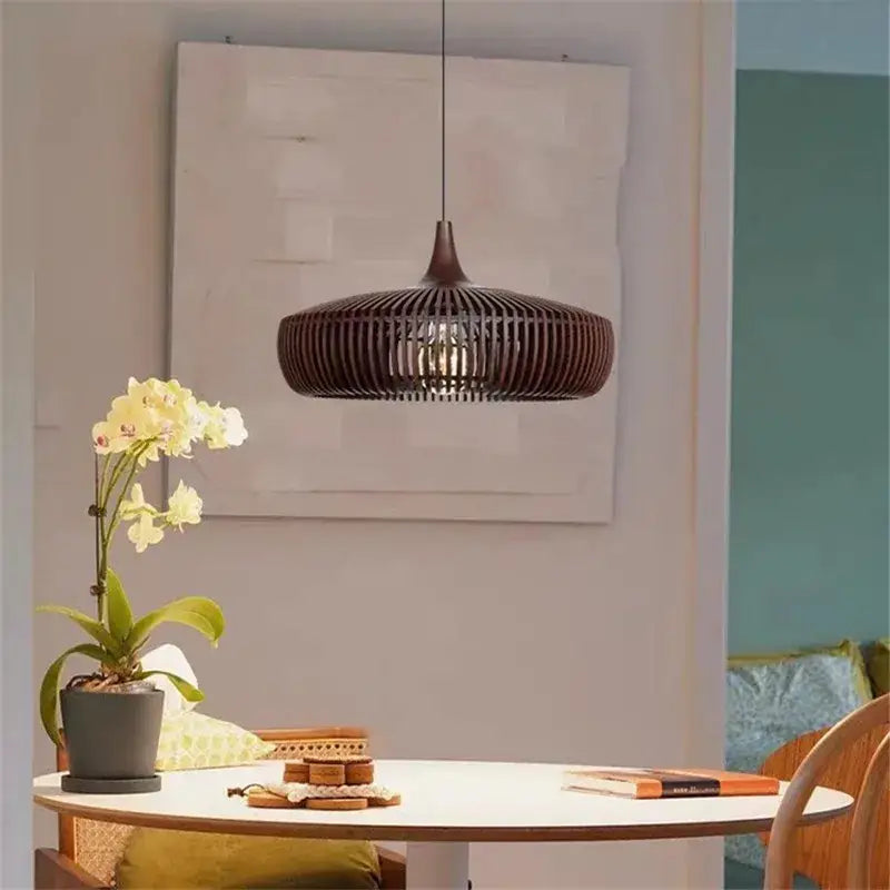 Dark brown woven rattan pendant light with sleek modern design serving as an elegant living room light source