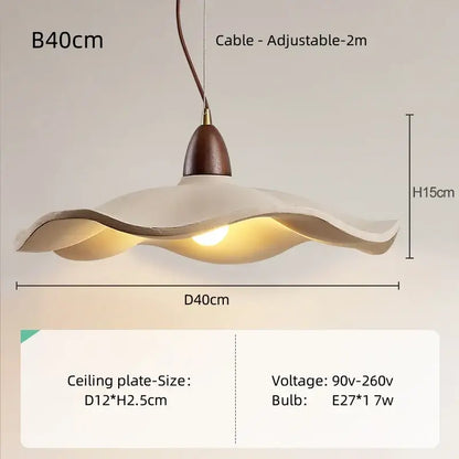 Cream-colored wavy edged pendant light with natural wood material and brass accent for dining room use