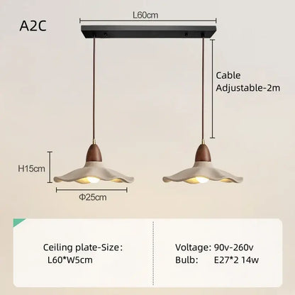 Modern double pendant light with flared off-white ceramic shades and natural wood material for dining room