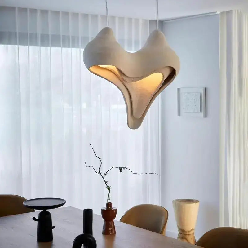Cream-colored gypsum conch pendant lamp with warm glow and organic design for living room decorbites gypsum conch