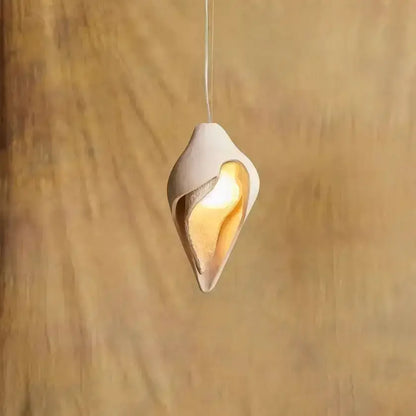 Wabi sabi cream gypsum conch pendant lamp with off-white ceramic shell design and warm golden glow for living room decorbites gypsum conch pendant