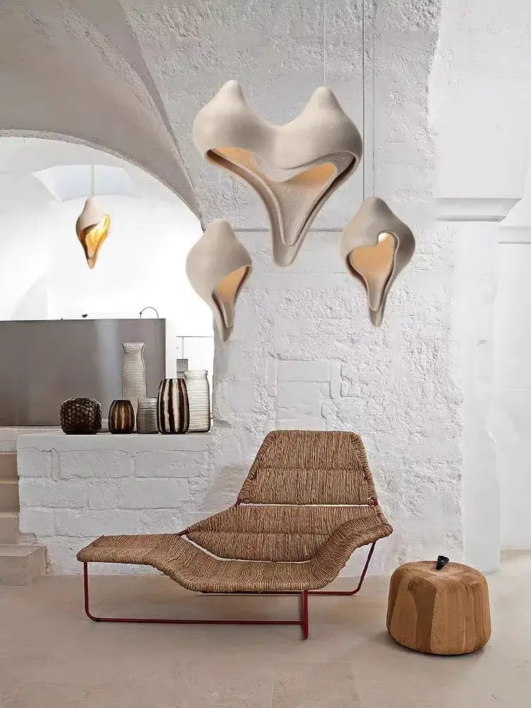 Wabi sabi cream gypsum pendant lamp with sculptural shell design and warm interior lighting for living room decor