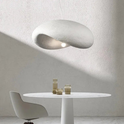 A sleek off-white pendant light with a textured cloud shape in decorbites cream style led for dining room decor