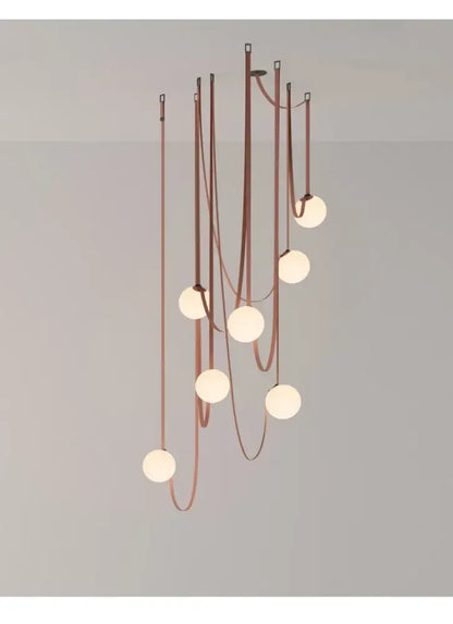 A wabi sabi designer copper and white chandelier with nine frosted glass bulbs for living room duplex wabi sabi decor
