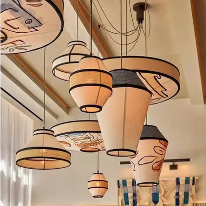 Beige and black woven fabric pendant lamp with whimsical fish illustrations for dining room wabi sabi decorbites colored wabi