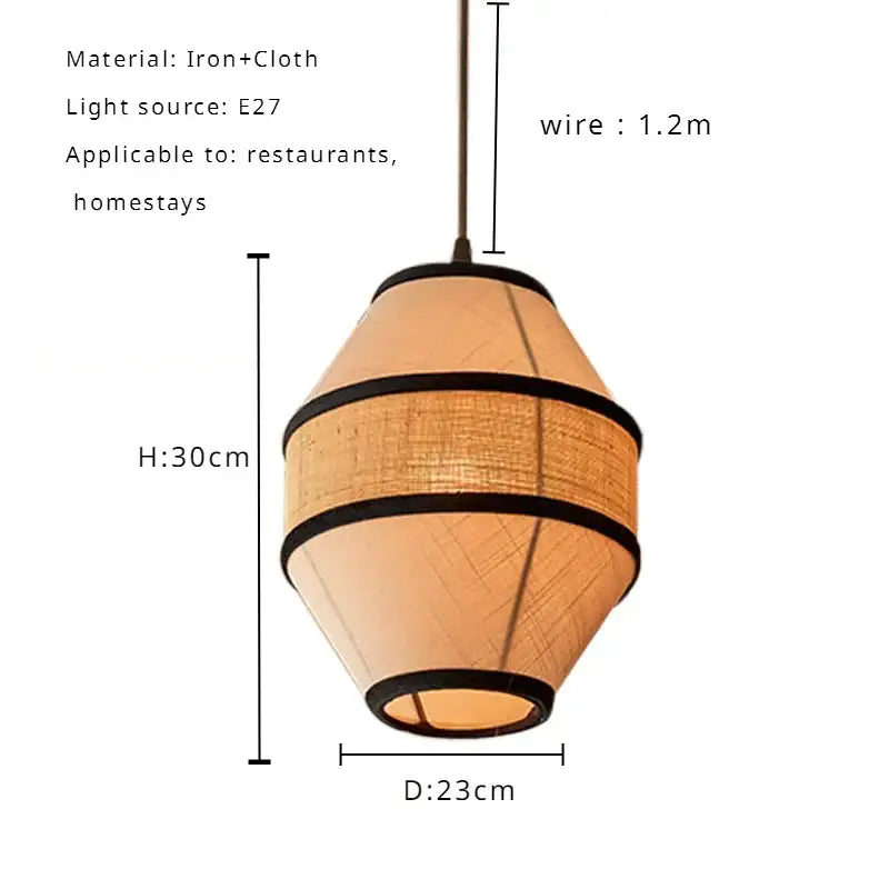 A warm-toned wabi sabi pendant lamp with a woven fabric shade and black trim for dining room decorbites colored wabi