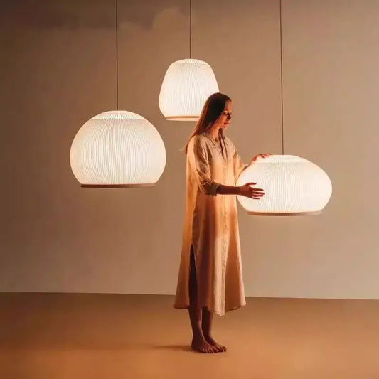 Warmly glowing decorbites chandelier with ribbed white fabric shade and wooden base for bedroom light luxury chandelier