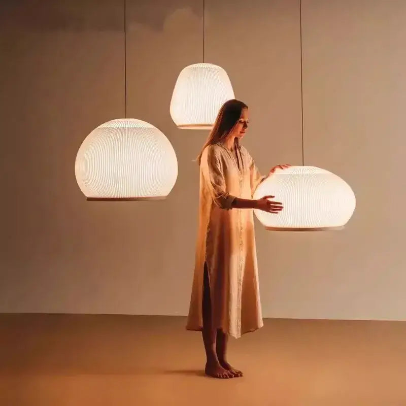 Warmly glowing decorbites chandelier with ribbed white fabric shade and wooden base for bedroom light luxury chandelier