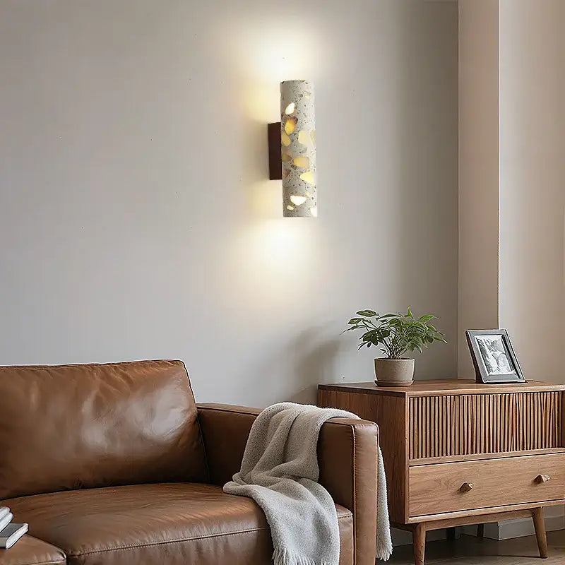 Cylindrical concrete wall lights with embedded golden circular accents for bedroom decorbites led wall lighting