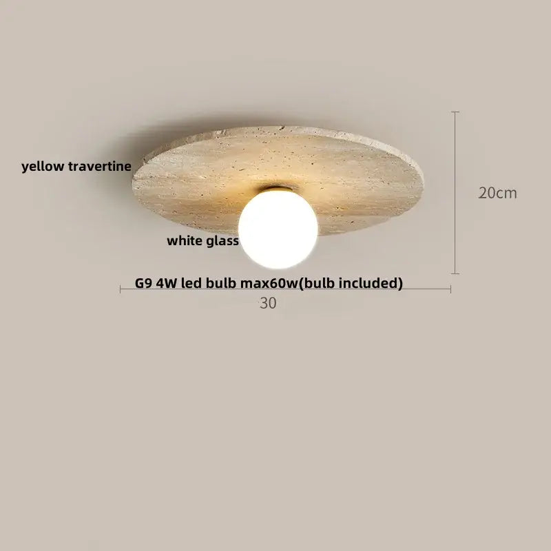 A modern ceiling lamp with a circular yellow travertine disc and white glass globe acrylic led ceiling light