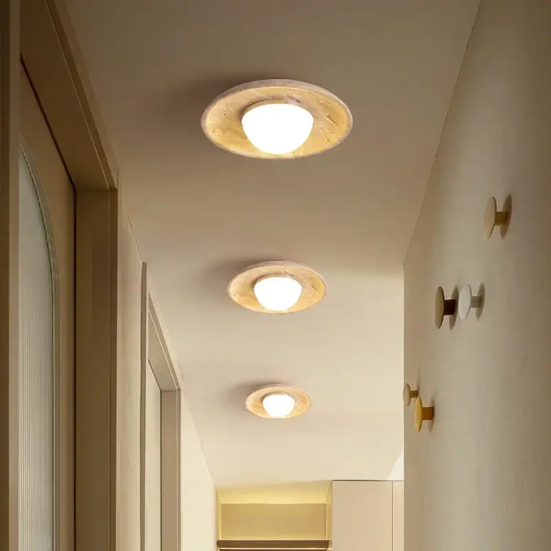 Three circular recessed ceiling lamps with warm bulbs in a rustic light wood canopy for bedroom decorbites acrylic led style