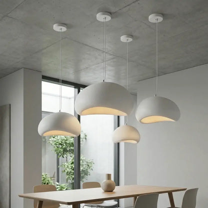Modern white pendant light with matte finish made of high-density polystyrene featuring led bulb for dining room use