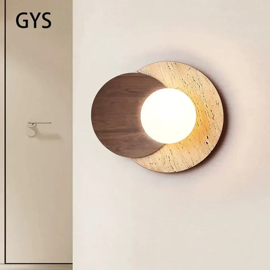 Modern circular wall lamp with warm wood and textured stone design featuring a glowing light for cream style bedroom decorbites cream style