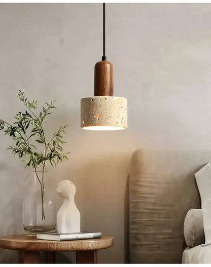 Wabi sabi yellow stone pendant light with warm wooden top and textured off-white concrete shade for dining room