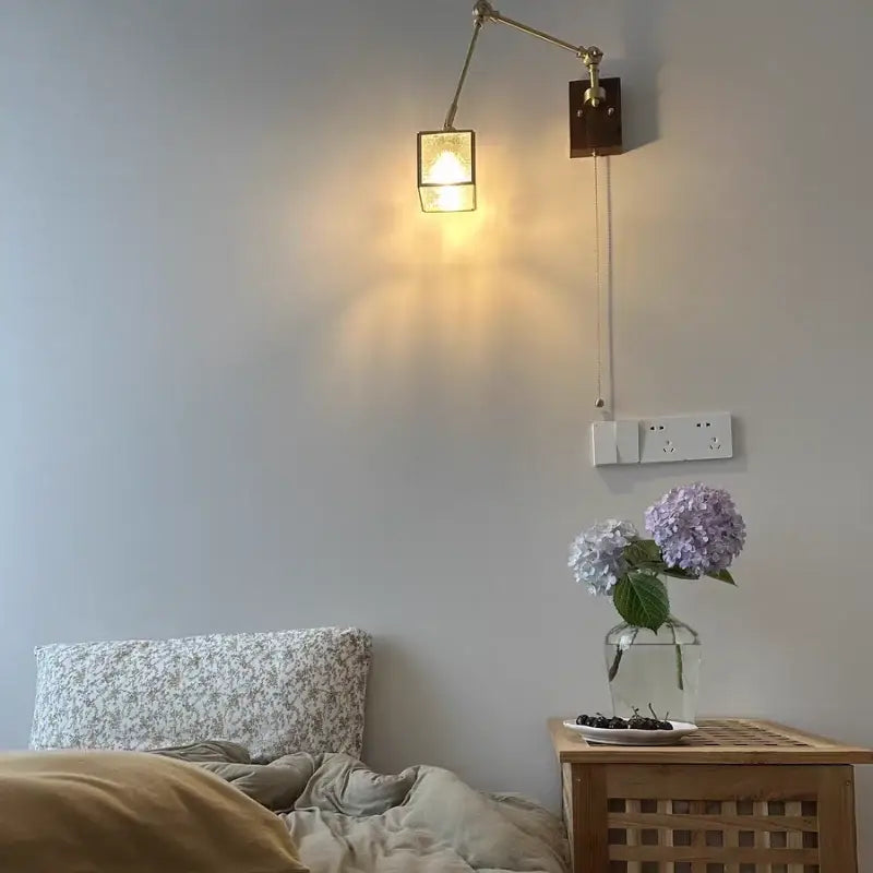 Brass wall sconce with adjustable arm and rectangular glass shade for bedroom mirror lighting by decorbites cube glass led