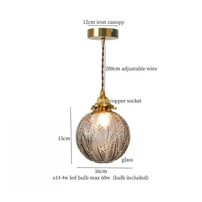 Warm brass cracked glass led pendant light with textured spherical glass, brass iron canopy, and copper socket for kitchen dining room decorbites cracked glass