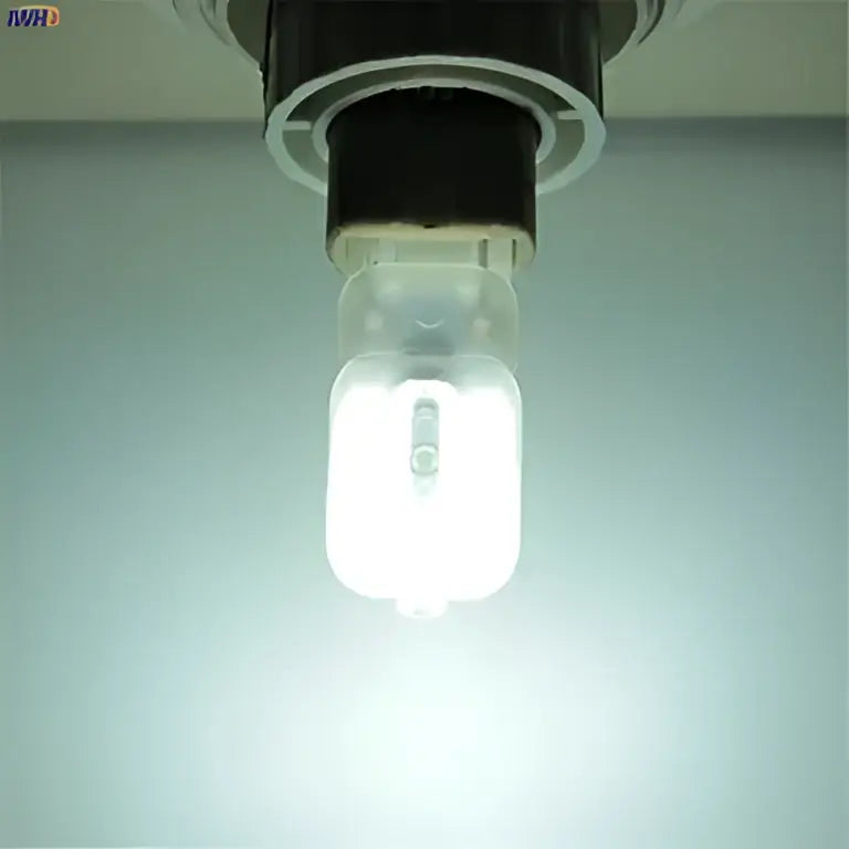 A bright white led corn light with clear glass housing and black base for ceiling mounting in warm white 5 pack