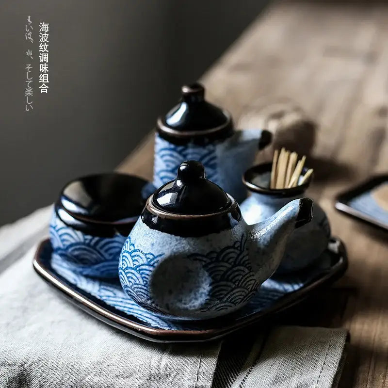 Blue and white ceramic seasoning set with wave patterns including teapot small jars and tray for blue ceramics kitchen decorbites