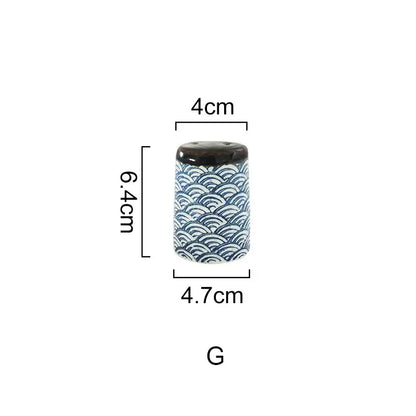 A cylindrical ceramic seasoning set with glossy dark brown lid and traditional blue wave patterns by decorbites blue ceramics