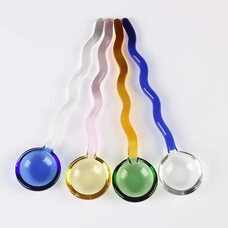 Set of five wavy colorful glass spoon coffee stirring rods with translucent round bowls in blue yellow green pink and clear