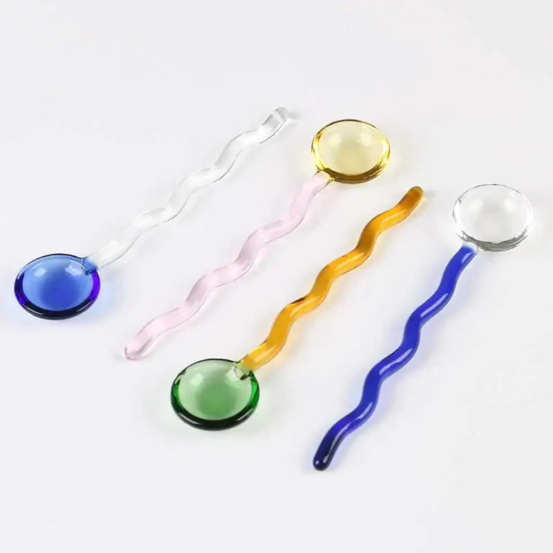 Set of five colorful glass spoon coffee stirring rods with wavy translucent handles in blue pink yellow green and clear
