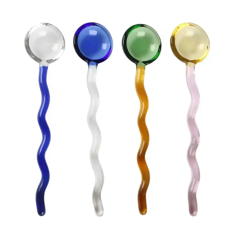 Wavy colorful glass spoon coffee stirring rod set features four translucent spoons in blue green yellow hues