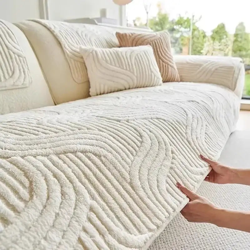 Cream-colored plush sofa cover with a textured wavy ribbed pattern for living room use