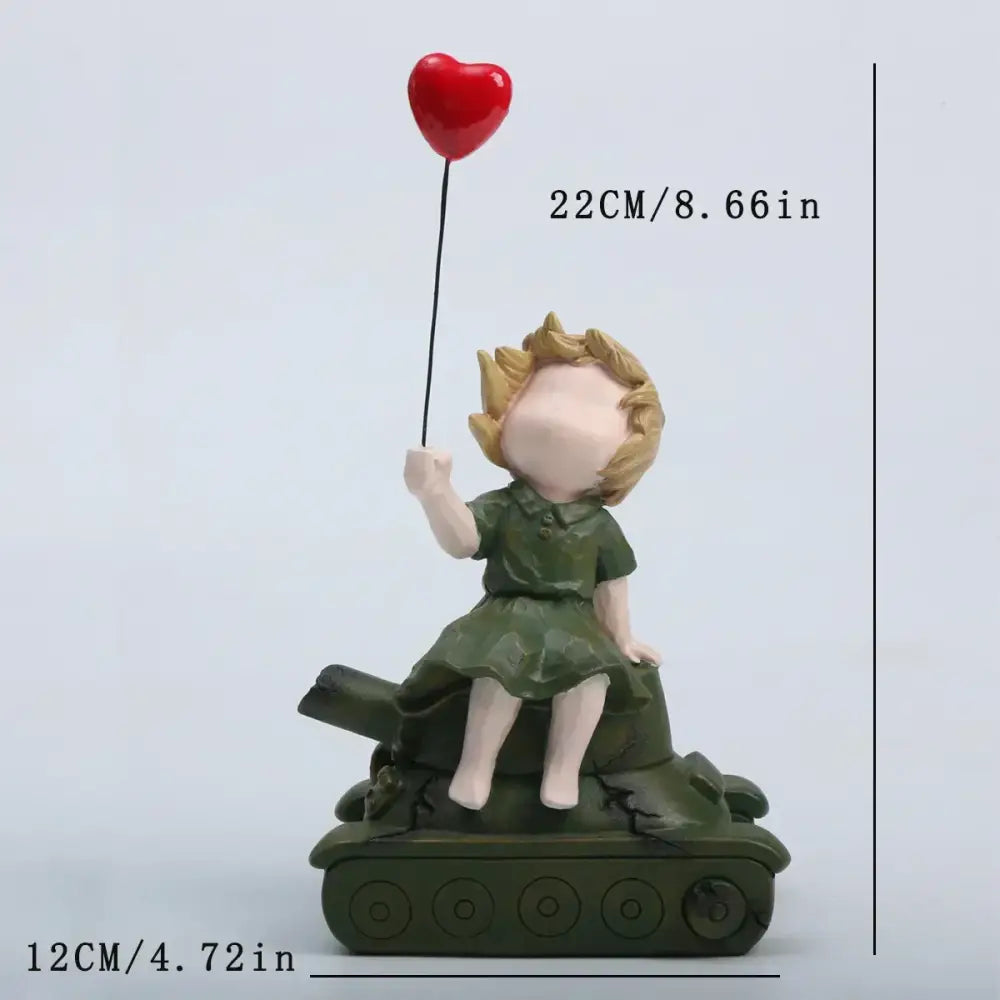 A resin balloon girl tank statue featuring a blonde child in green dress holding red balloon for living room decor