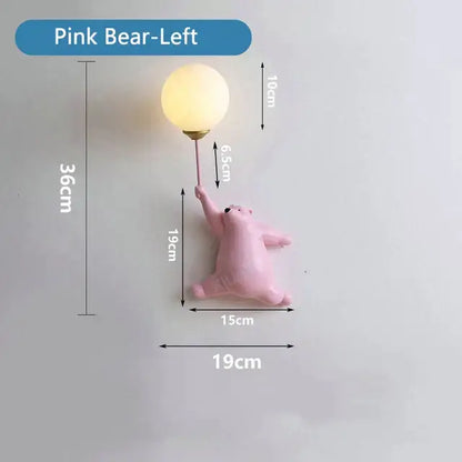 Whimsical blue pink and white bear wall lamp for kids bedroom featuring a pink bear wall lamp with warm round bulb held aloft